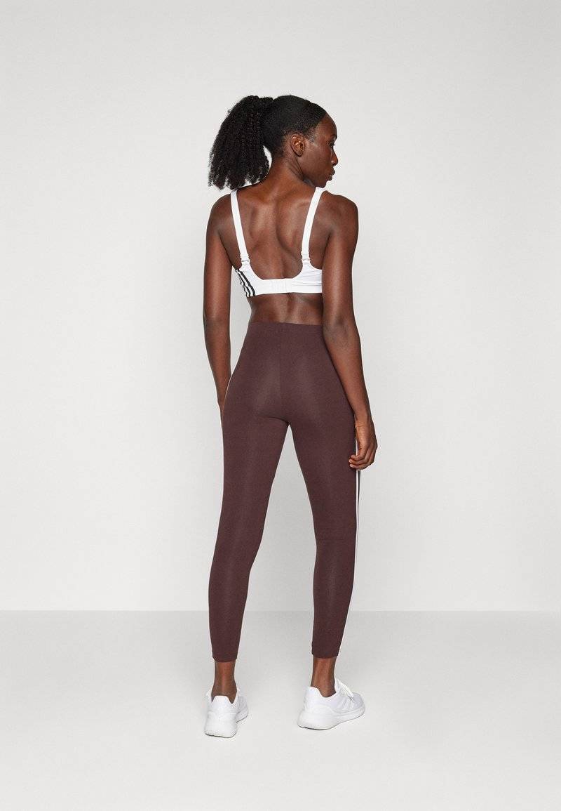 adidas Sportswear adidas Sportswear ESSENTIALS 3 STRIPES HIGH WAISTED - Leggings - shadow brown Räumungsverkauf