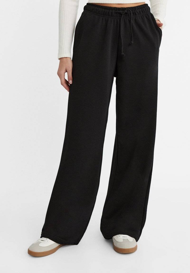 Stradivarius Stradivarius WIDE-LEG JOGGER - Tracksuit bottoms - black Hotsell