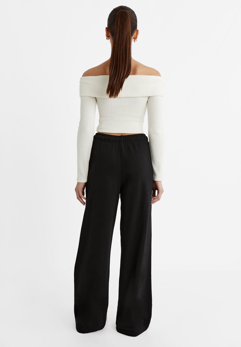 Stradivarius Stradivarius WIDE-LEG JOGGER - Tracksuit bottoms - black Hotsell