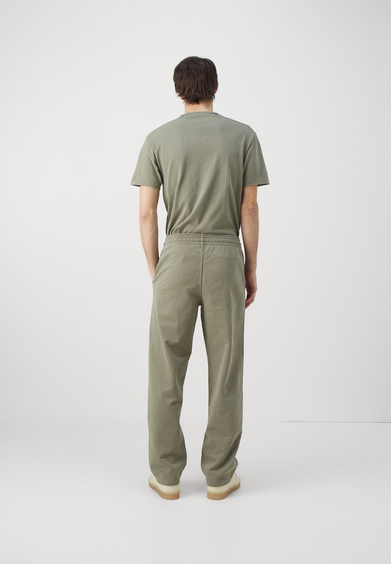 Holzweiler Holzweiler LAGOON OSLO TROUSERS UNISEX - Tracksuit bottoms - green Bis zu 60% Rabatt