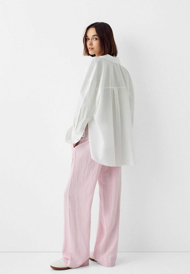 Bershka Bershka WITH AN ELASTIC - Trousers - light pink Auslauf