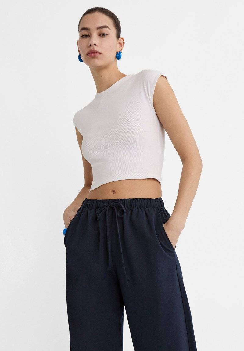 Stradivarius Stradivarius LONG FLOWING - Trousers - mottled dark blue Hotsell