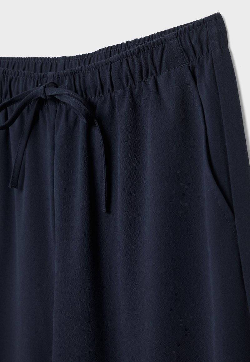 Stradivarius Stradivarius LONG FLOWING - Trousers - mottled dark blue Hotsell