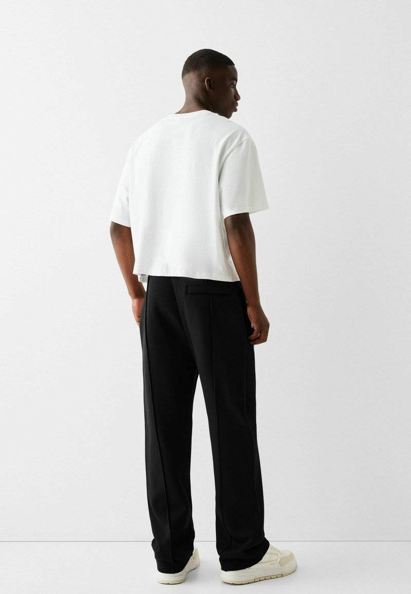Bershka Bershka WIDE - Tracksuit bottoms - black Schlussverkauf