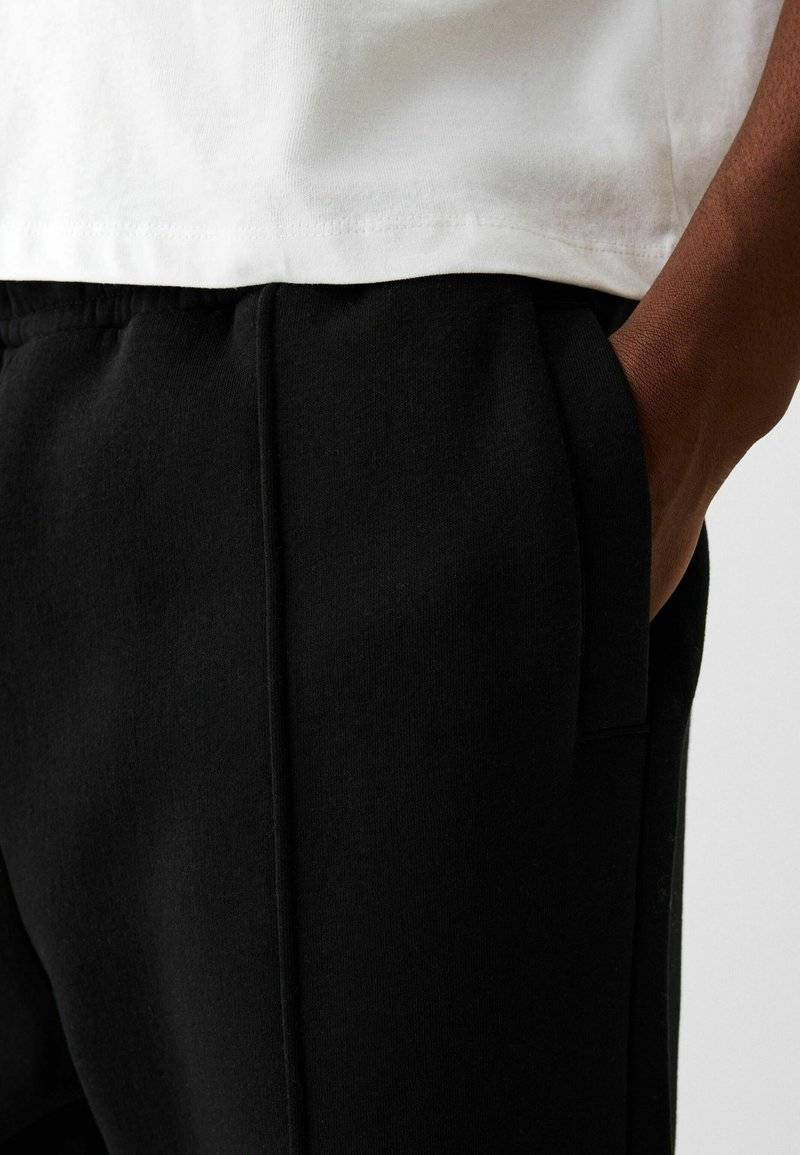 Bershka Bershka WIDE - Tracksuit bottoms - black Schlussverkauf