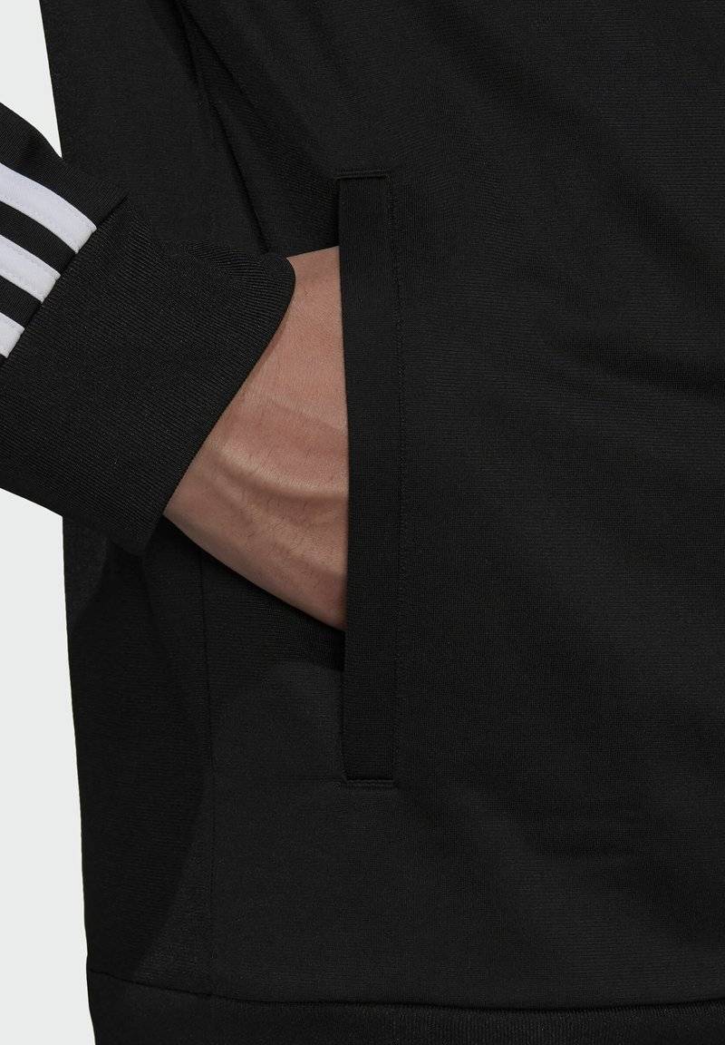 adidas Sportswear adidas Sportswear ESSENTIALS WARM-UP REGULAR 3-STRIPES - Training jacket - black Wochenangebot