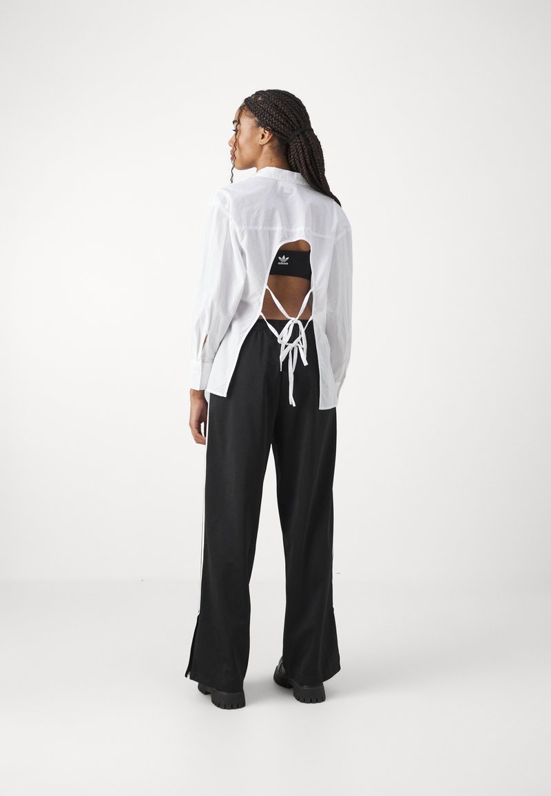 adidas Originals adidas Originals FBIRD LOOSE - Tracksuit bottoms - black Fabrikladen