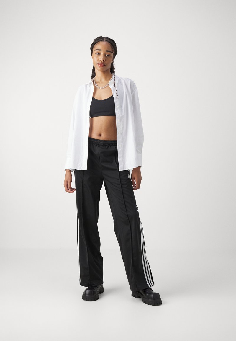 adidas Originals adidas Originals FBIRD LOOSE - Tracksuit bottoms - black Fabrikladen