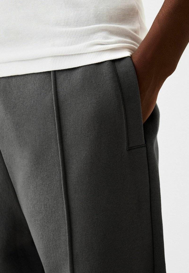 Bershka Bershka WIDE - Tracksuit bottoms - dark grey 2025