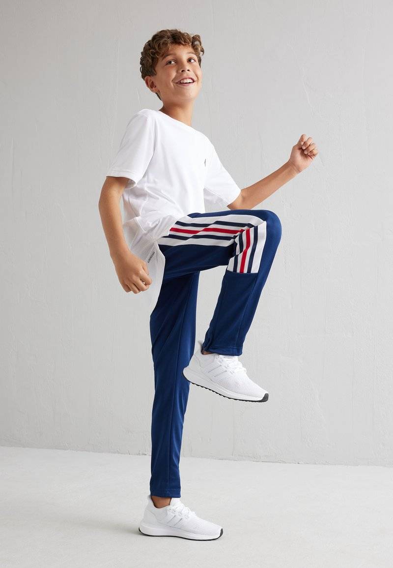 adidas Performance adidas Performance TIRO NATIONS PACK UNISEX - Tracksuit bottoms Blitzverkäufe