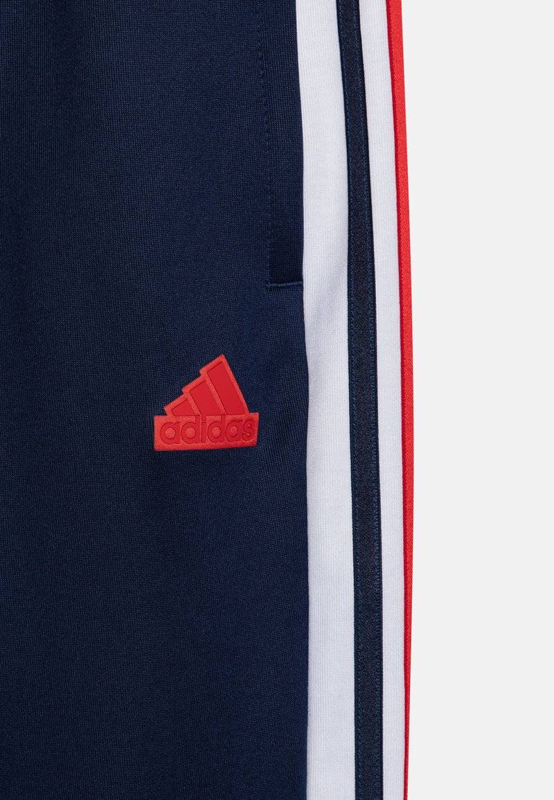 adidas Performance adidas Performance TIRO NATIONS PACK UNISEX - Tracksuit bottoms Blitzverkäufe