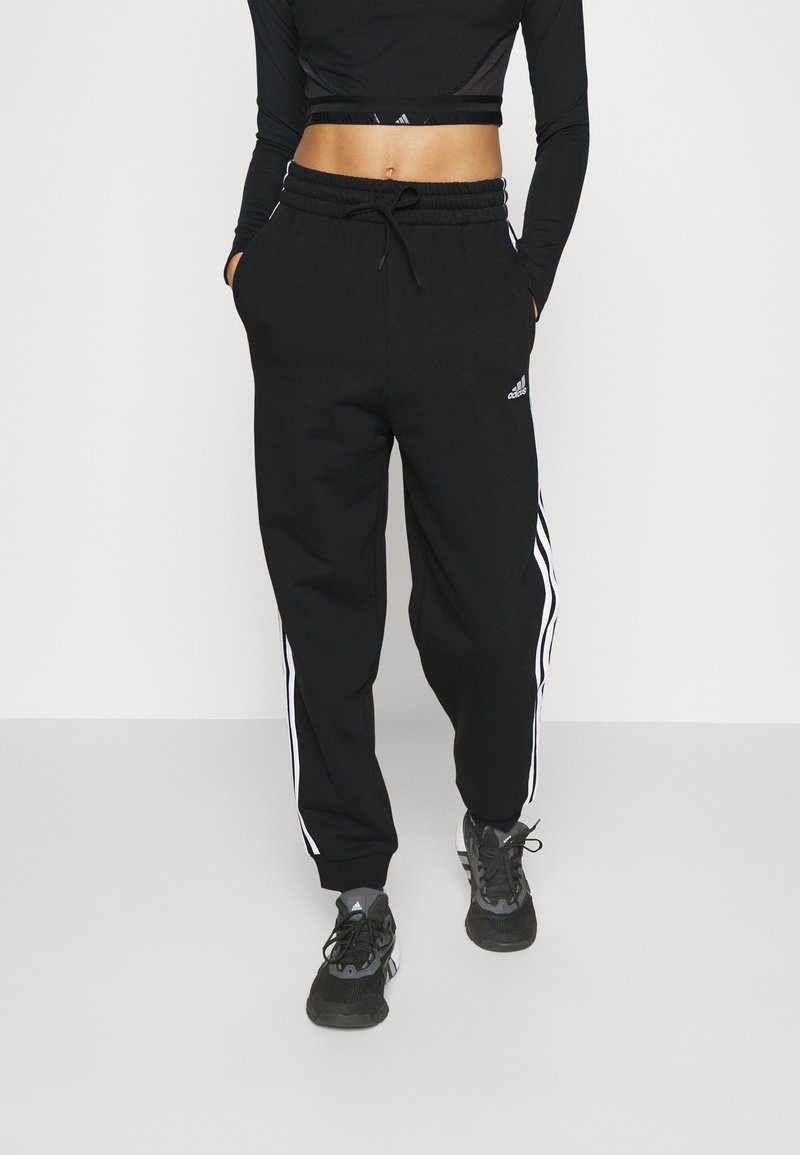 adidas Sportswear adidas Sportswear ESSENTIALS 3-STRIPES LOOSE-FIT - Tracksuit bottoms