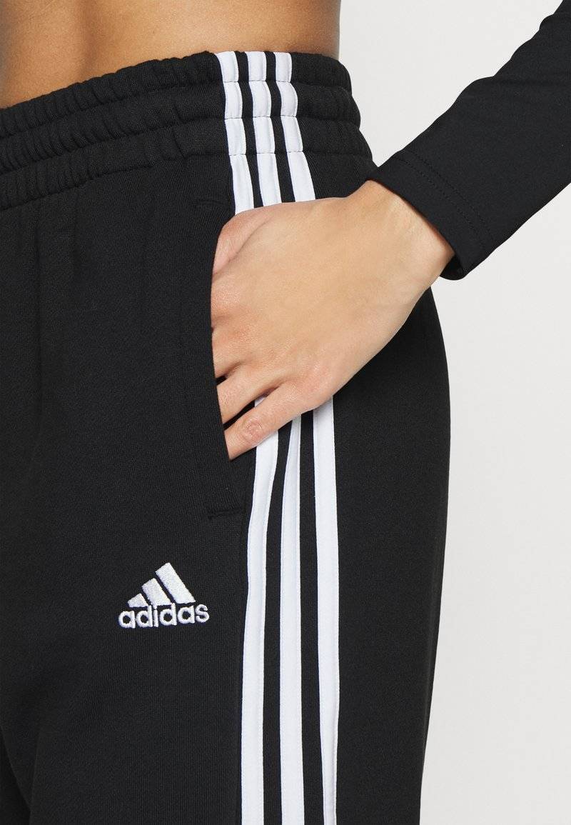 adidas Sportswear adidas Sportswear ESSENTIALS 3-STRIPES LOOSE-FIT - Tracksuit bottoms Cyber Monday
