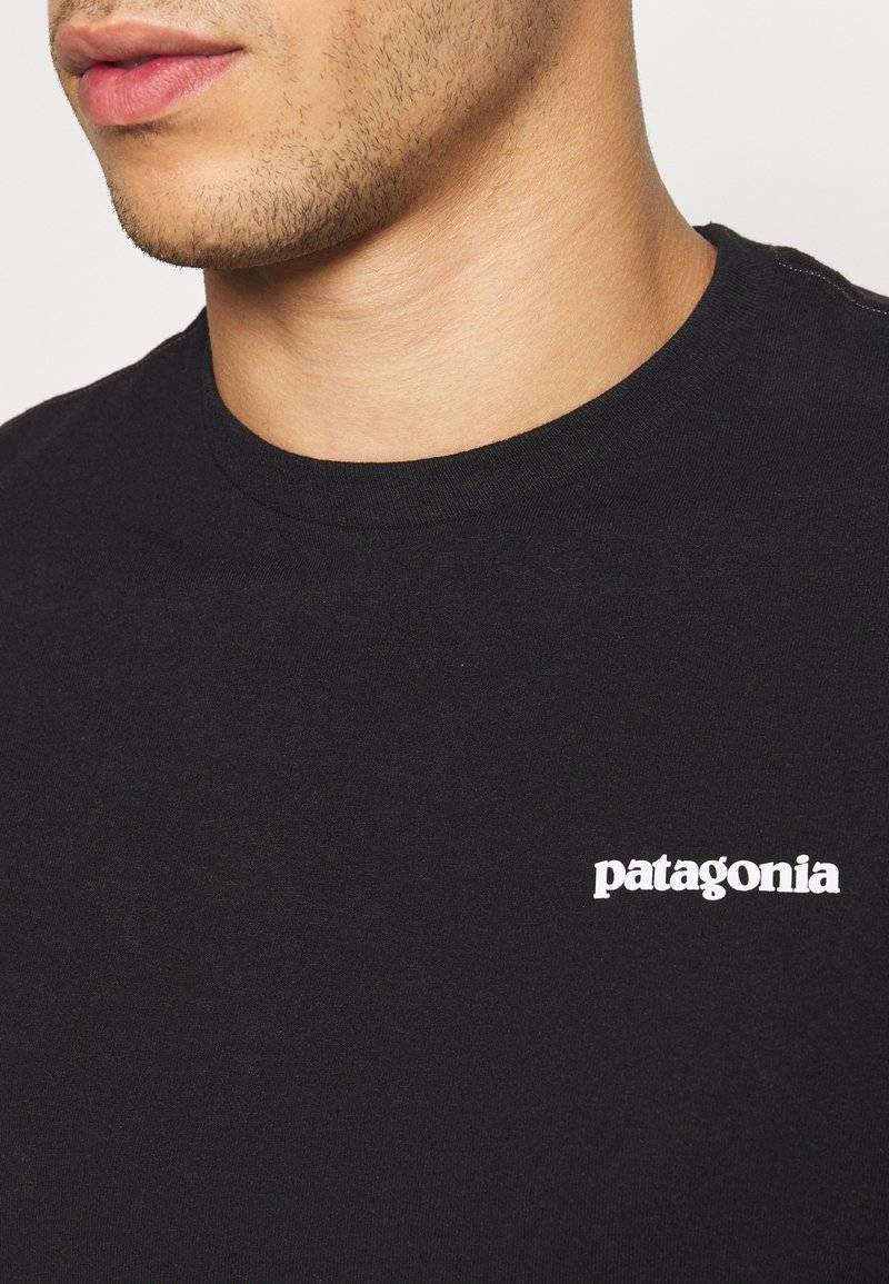 Patagonia Patagonia LOGO TEE - Print T-shirt - black Fabrikverkauf