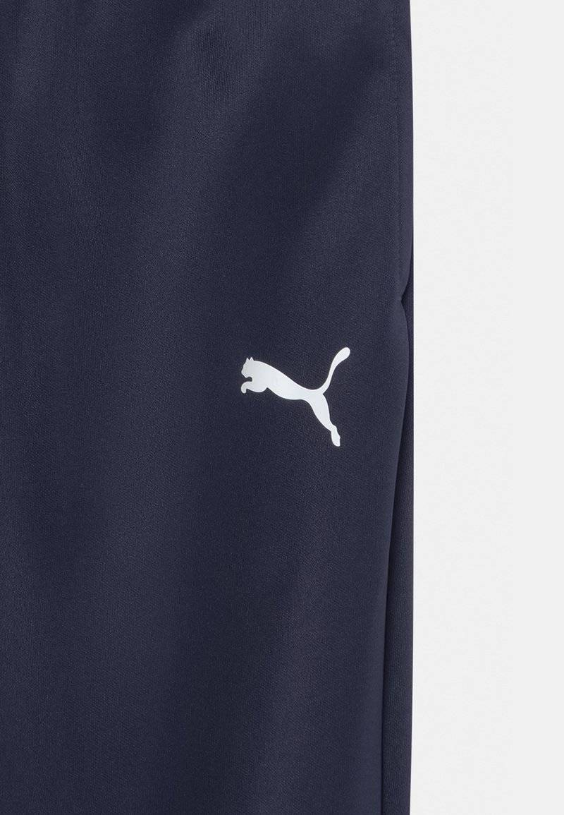 Puma Puma TEAMRISE POLY TRAINING UNISEX - Tracksuit bottoms Fabrikverkauf