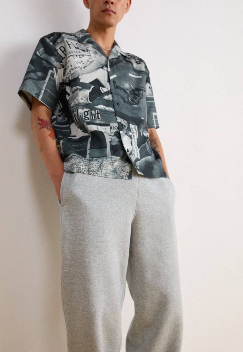 Nike Sportswear Nike Sportswear BUNGIE PANT - Tracksuit bottoms - grey heather Riesige Ersparnisse