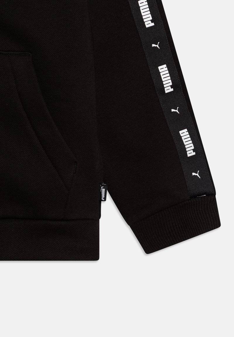 Puma Puma TAPE SWEAT SUIT UNISEX SET - Tracksuit - black Exklusivangebot