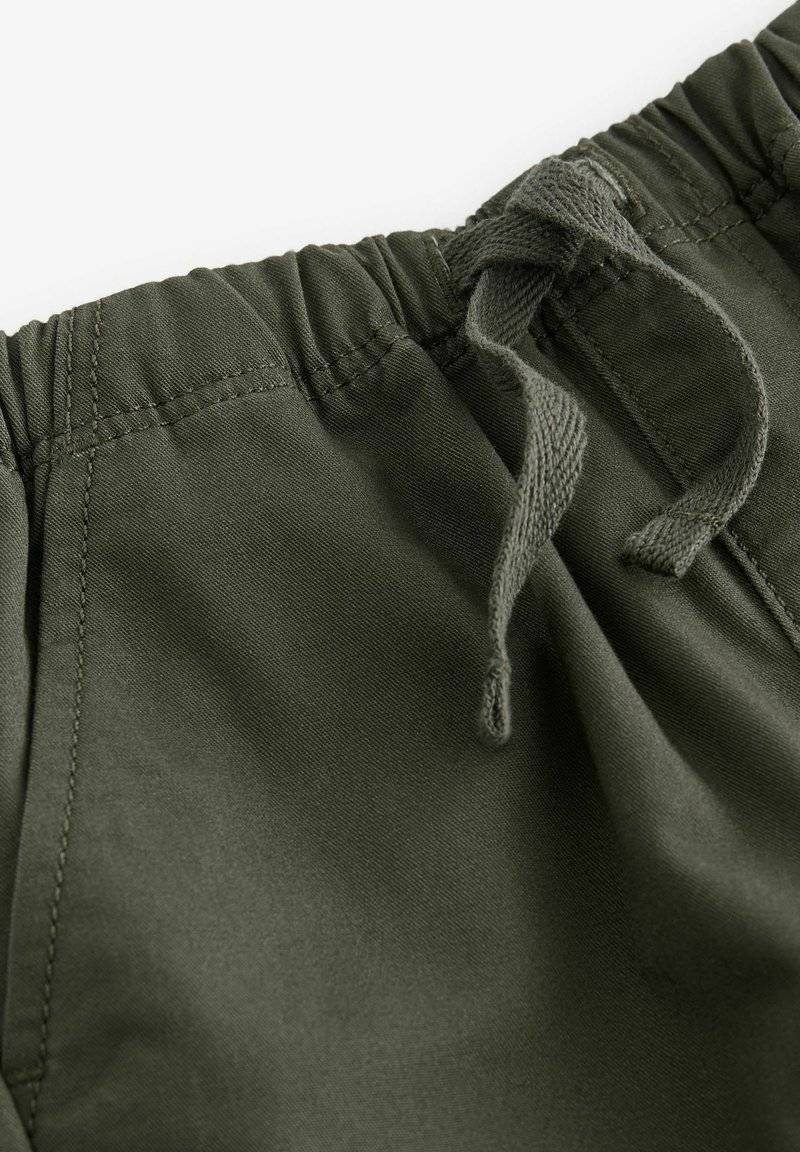 Next Next SIDE POCKET PULL-ON STANDARD - Trousers - khaki green Fabrik Onlineshop