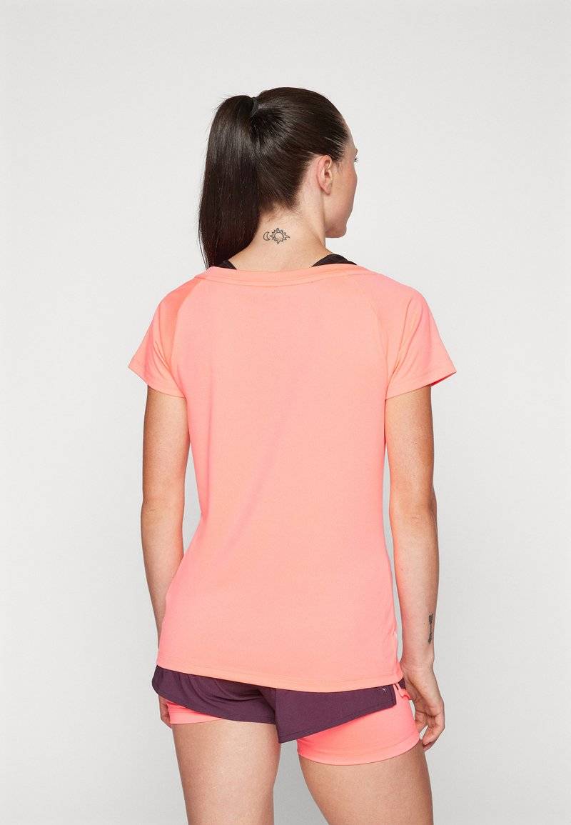 Puma Puma TRAIN FAVORITE CAT TEE - Sports T-shirt - sunset glow Sonderangebote