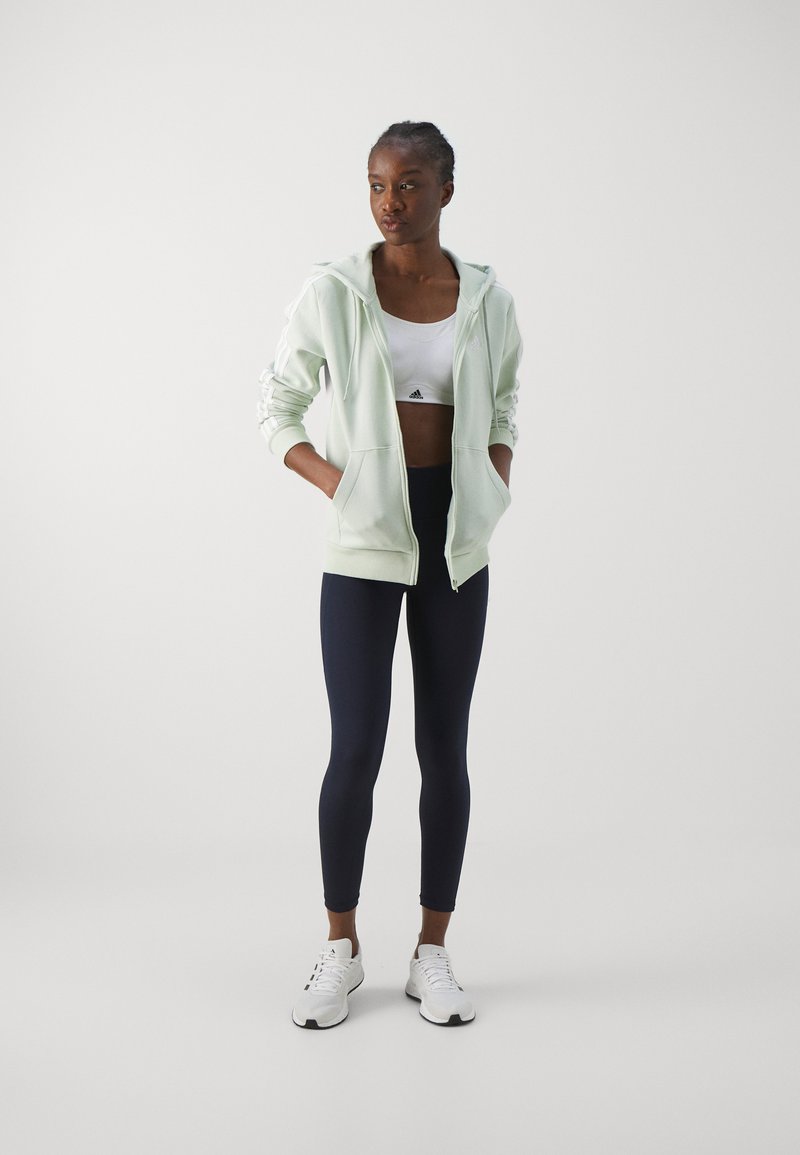 adidas Sportswear adidas Sportswear ESSENTIALS 3 STRIPES FULL ZIP HOODIE - Zip-up sweatshirt - linen green Wochenangebot