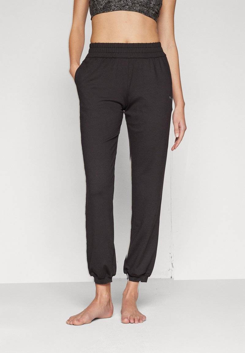 Puma Puma STUDIO FOUNDATIONS - Tracksuit bottoms - black