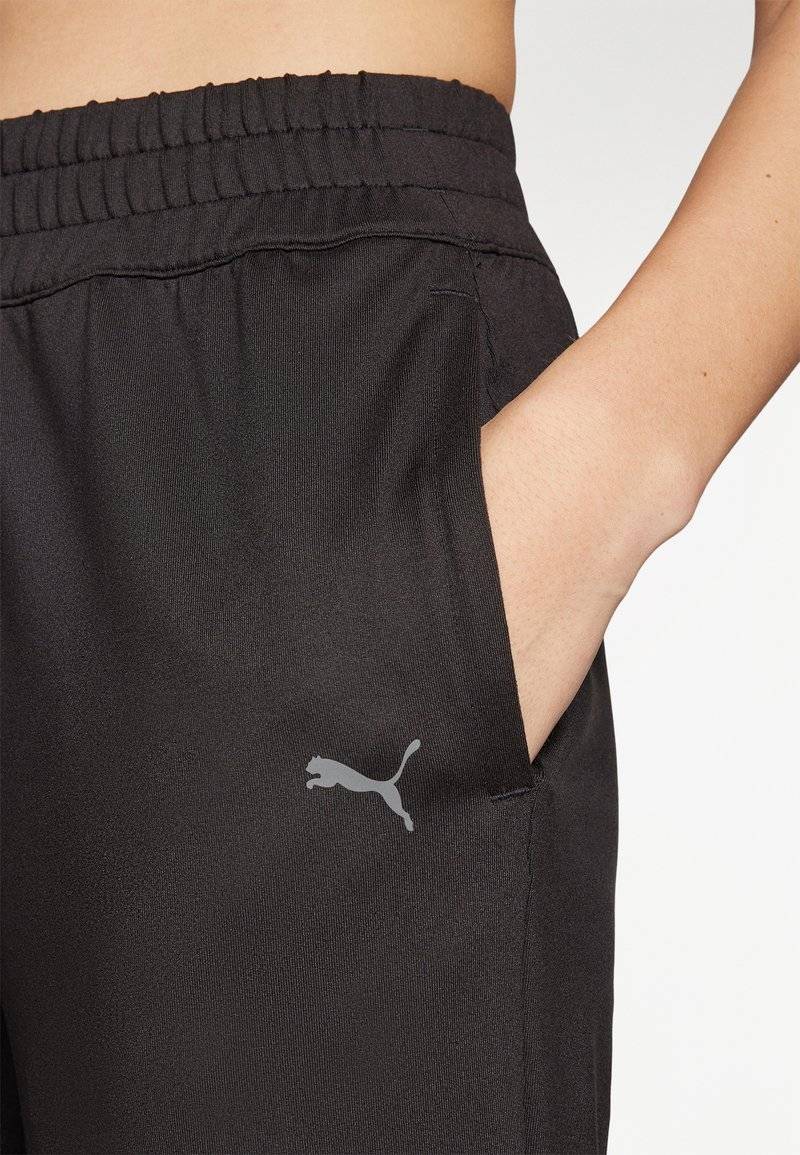 Puma Puma STUDIO FOUNDATIONS - Tracksuit bottoms - black Kostenloser Versand