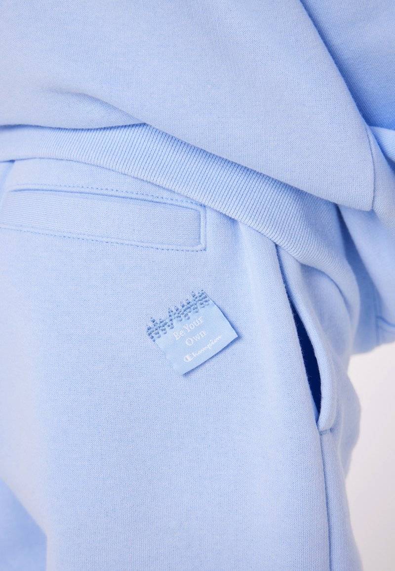 Champion Champion EXCLUSIVE PANT UNISEX - Tracksuit bottoms - light blue Saisonale Angebote