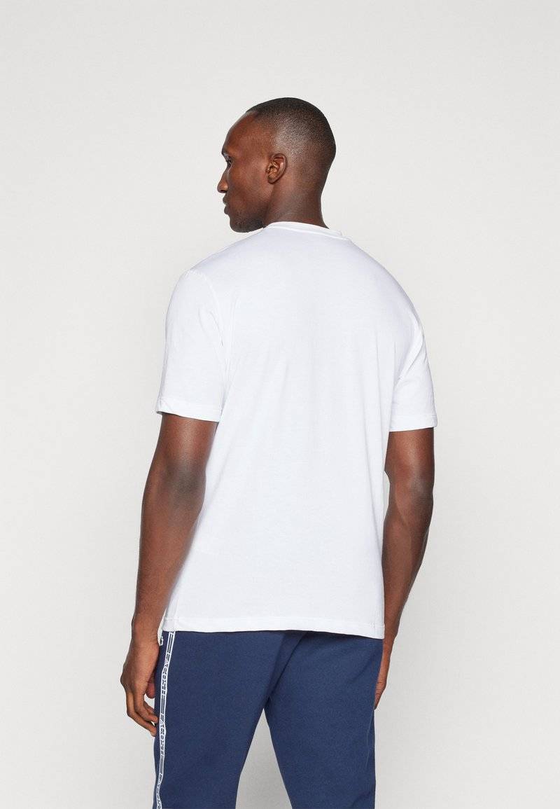 Lacoste Sport Lacoste Sport SPORTS - Basic T-shirt - white Kauf eins, bekomm eins gratis