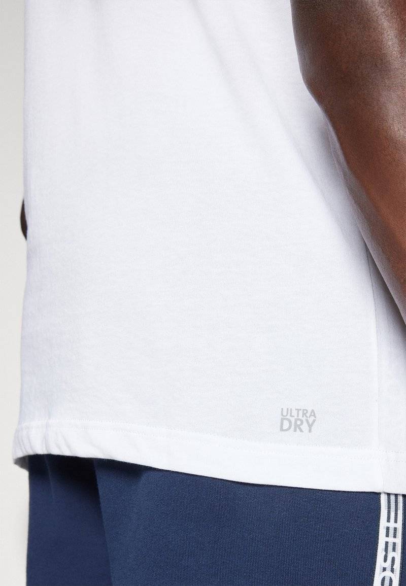Lacoste Sport Lacoste Sport SPORTS - Basic T-shirt - white Kauf eins, bekomm eins gratis