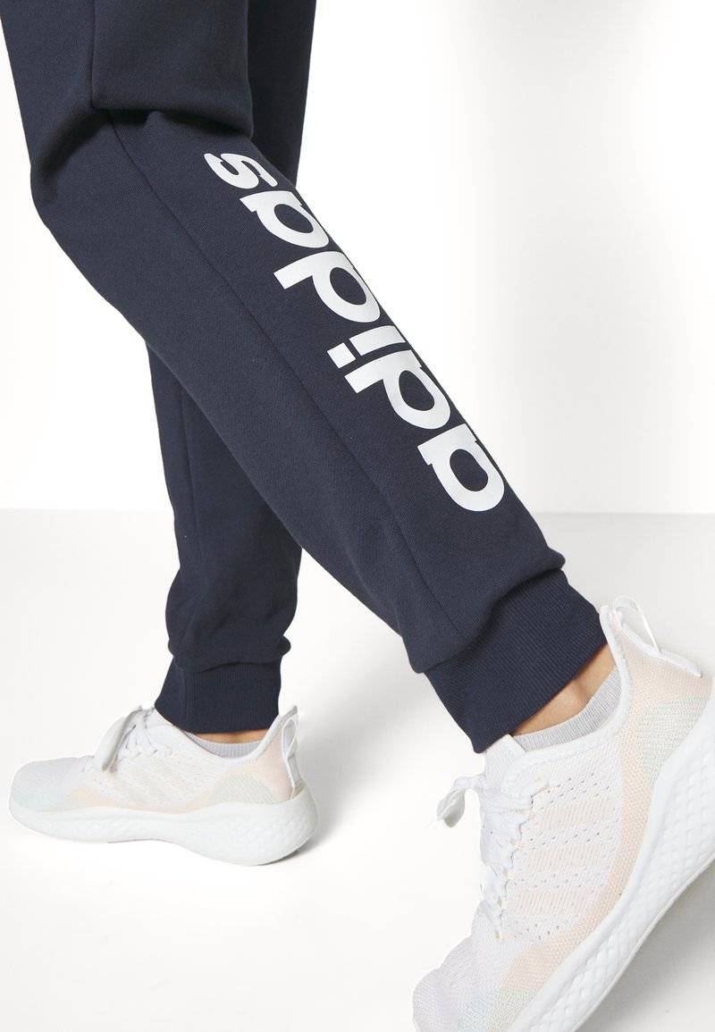 adidas Sportswear adidas Sportswear ESSENTIALS LINEAR CUFFED - Tracksuit bottoms - legend ink Bis zu 65% Rabatt