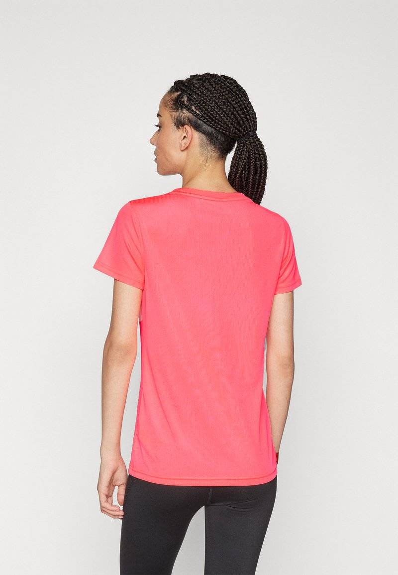 Puma Puma PERFORMANCE TEE - Sports T-shirt - sunset glow im Angebot