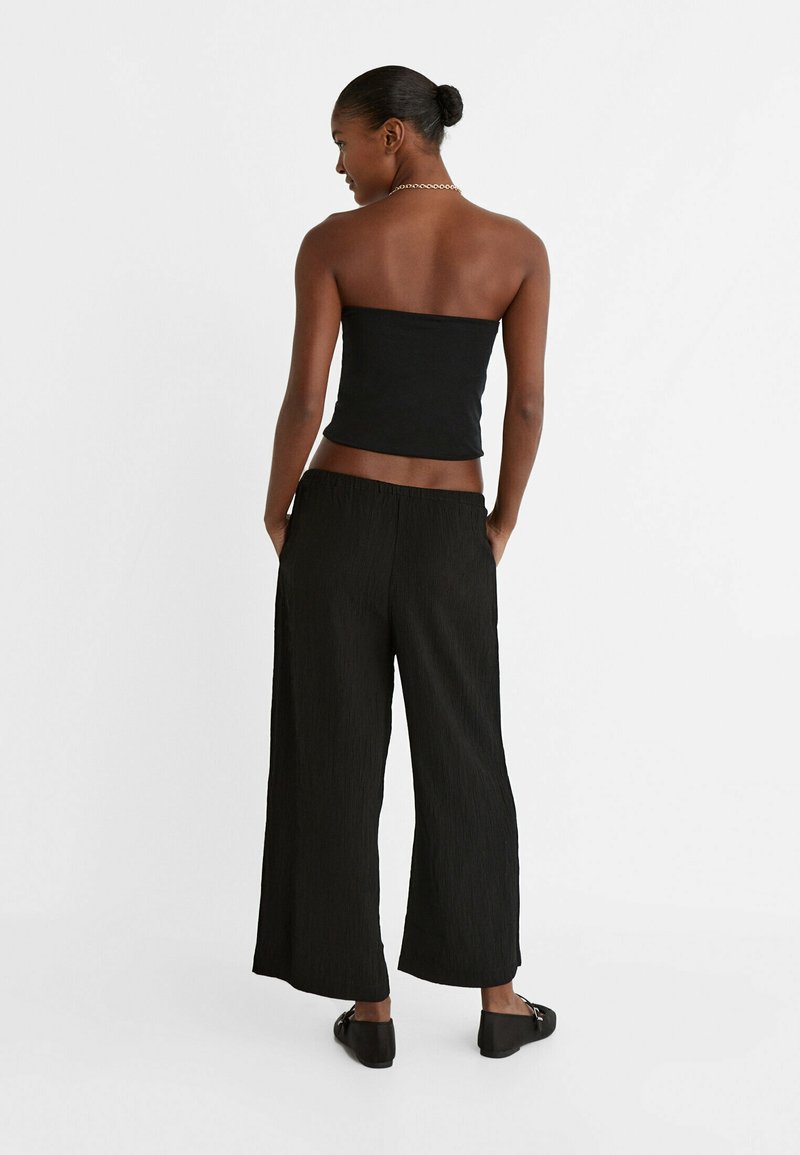 Stradivarius Stradivarius FLOWING CULOTTES - Trousers - black Günstiger Verkauf