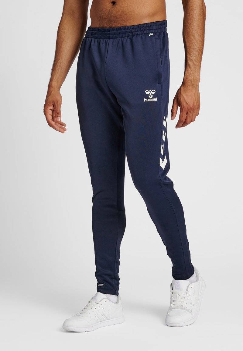 Hummel Hummel CORE XR TRAINING PANTS - Tracksuit bottoms - marine Fabrikpreis