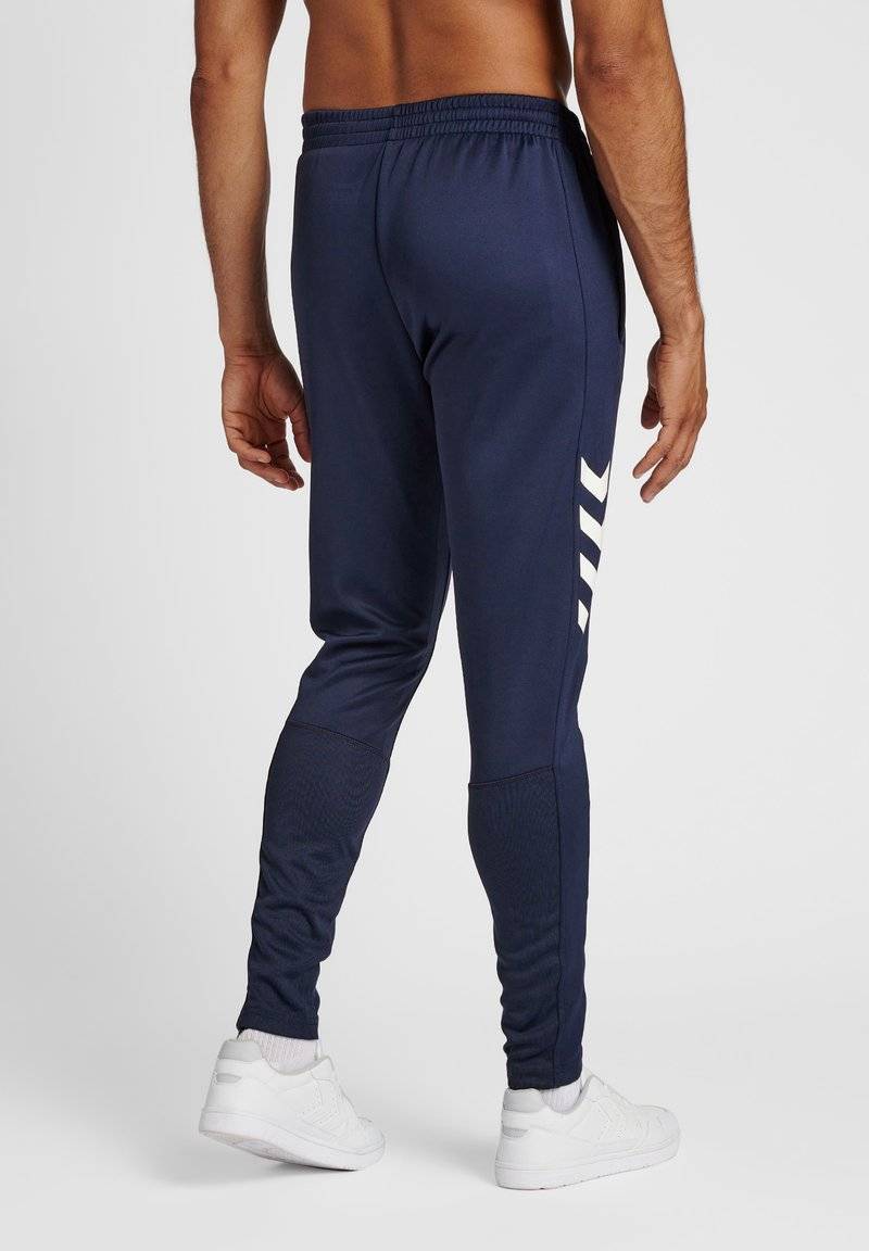 Hummel Hummel CORE XR TRAINING PANTS - Tracksuit bottoms - marine Fabrikpreis
