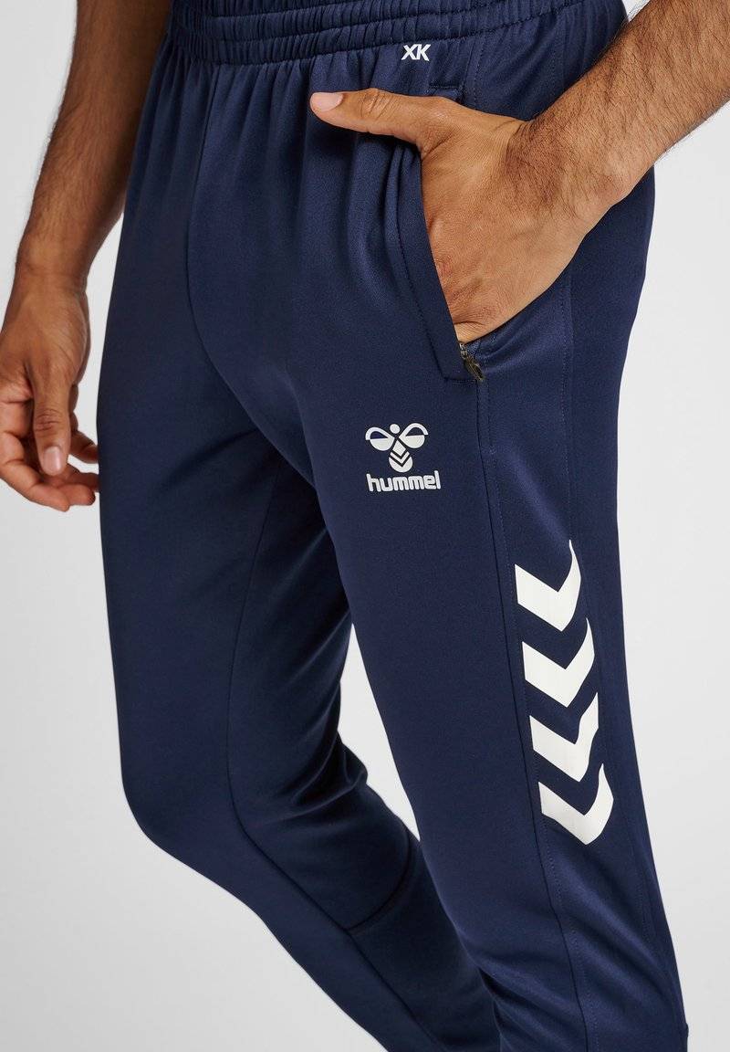 Hummel Hummel CORE XR TRAINING PANTS - Tracksuit bottoms - marine Fabrikpreis